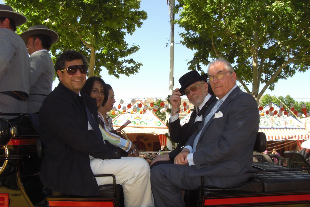  Feria de Sevilla 2009. Rolf and friends, doing the paseo. On the left his lawyer from Bogata, Eduardo, and wife Nora. Then there’s Esperanza, wife of…Adolfo, who is sitting on the right next to Rolf. Esperanza and Adolfo are owners of one of his favourite Feria de Sevilla casetas, and this is their private horse carriage, drawn by six black Arab stallions.
