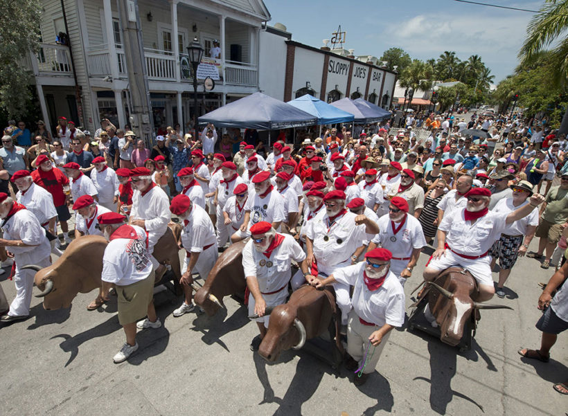 Ernest Hemingway look- alikes kick off the Running of the Bulls Saturday, July 19, 2014, in Key West, Fla. The whimsical event, a parody of its namesake in Pamplona, Spain, is one of many events during Key West’s Hemingway Days festival that continues through Sunday, July 20. Hemingway lived and wrote in Key West throughout most of the 1930s. FOR EDITORIAL USE ONLY (Andy Newman/Florida Keys News Bureau/HO)